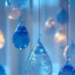 Colorful Blue Crayon Raindrop Suncatchers catching sunlight