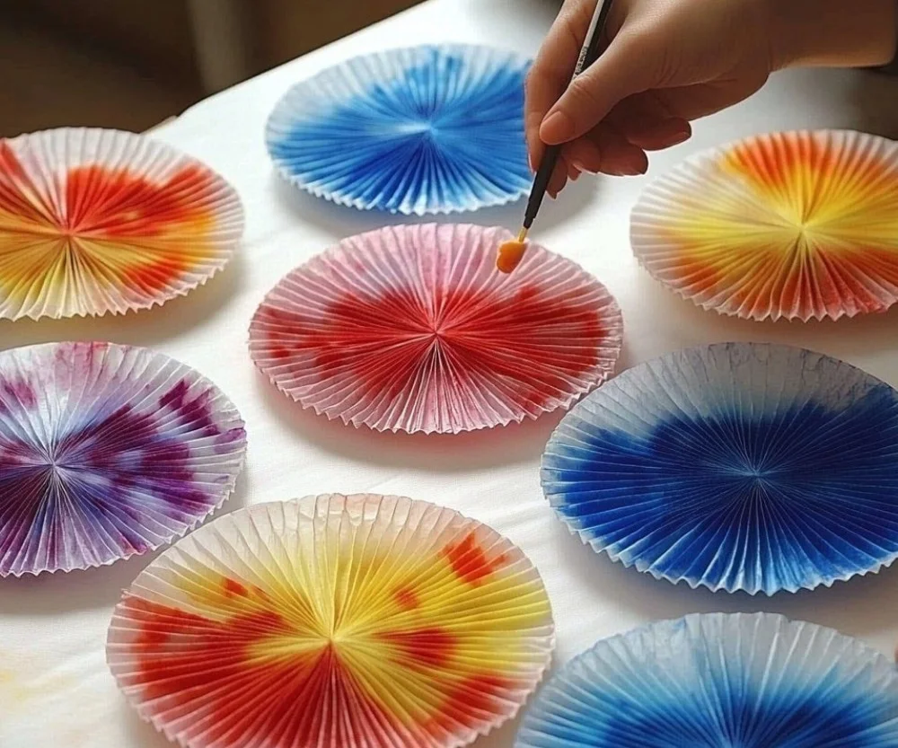 Colorful coffee filter fireworks art project for kids and creativity.