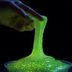 A vibrant Firefly Light Slime glowing in the dark, perfect for play.