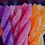 Homemade Kool-Aid licorice ropes in vibrant colors and fun shapes.