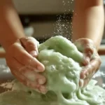 Colorful dish soap slime in a bowl with playful textures and shapes.