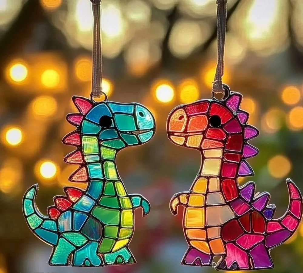 Colorful dinosaur suncatchers hanging in the sunlight