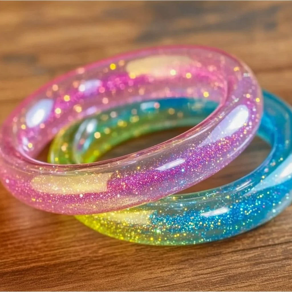 Colorful DIY glitter tube bracelets sparkling with creativity and fun.