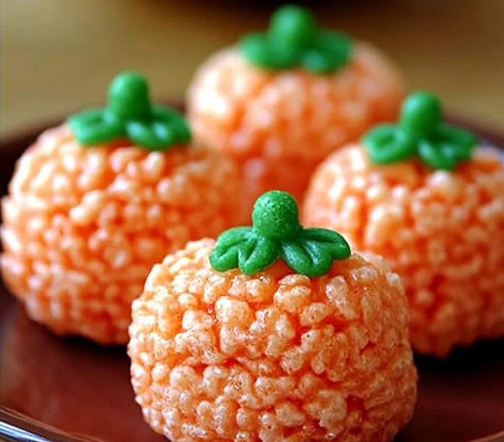 Festive Rice Krispie Treat pumpkins decorated for Halloween