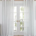 Guide on how to choose curtains for living room with tips on color, fabric, and style.