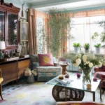 Cozy boho style living room featuring eclectic decor, soft textures, and plants.