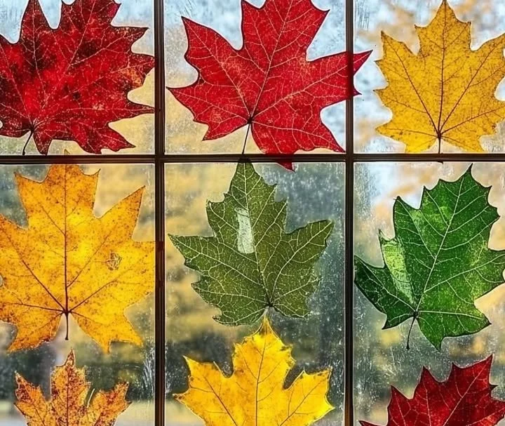 Colorful DIY leaf print window art showcasing nature-inspired designs.