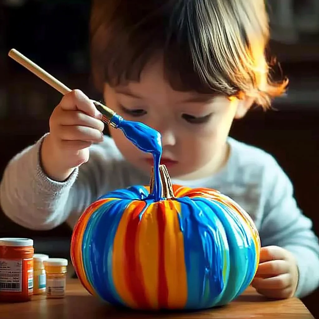 Vibrant rainbow pour-paint pumpkins decorated with colorful swirls