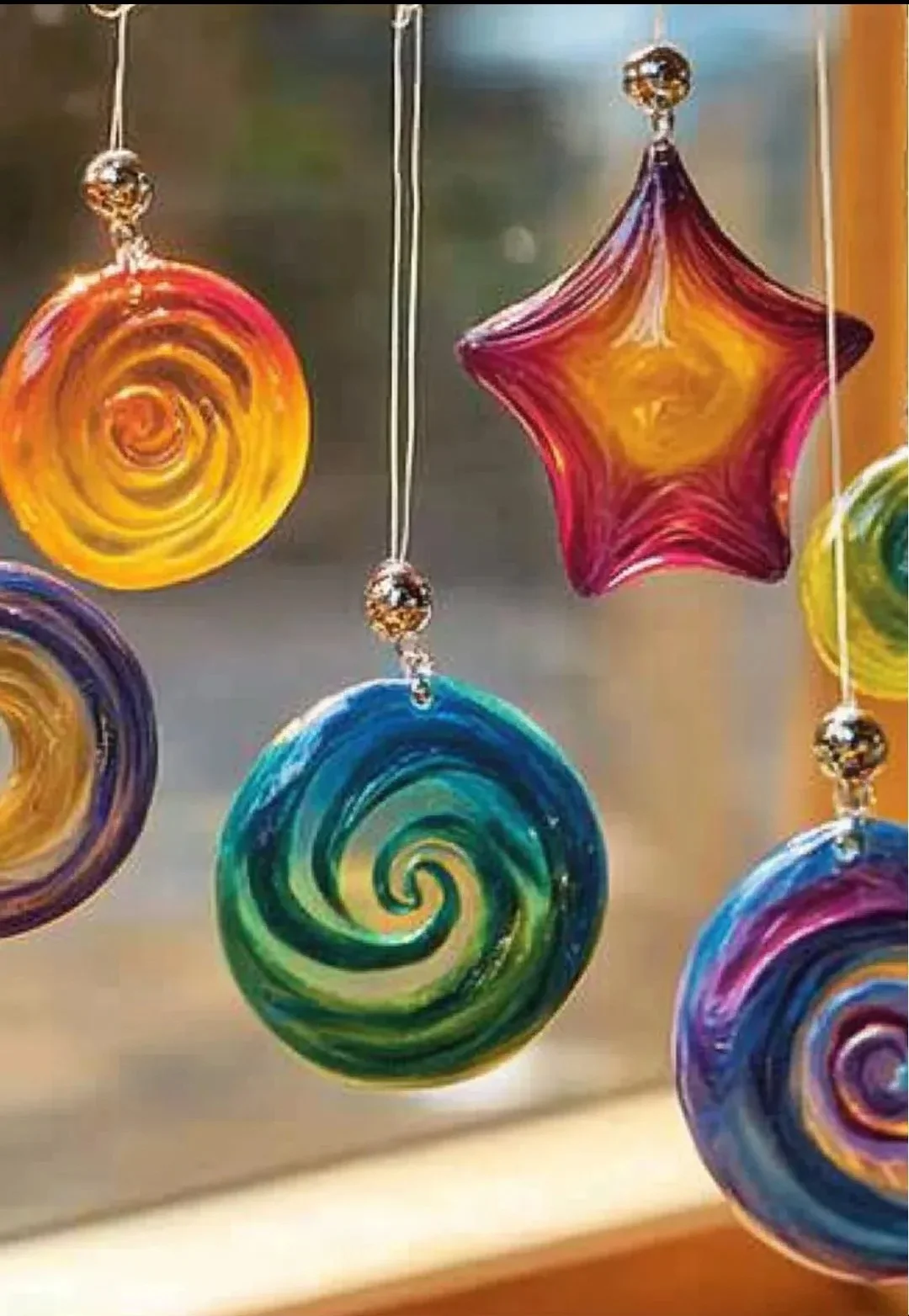 DIY glue suncatchers with colorful designs and light-catching beauty.