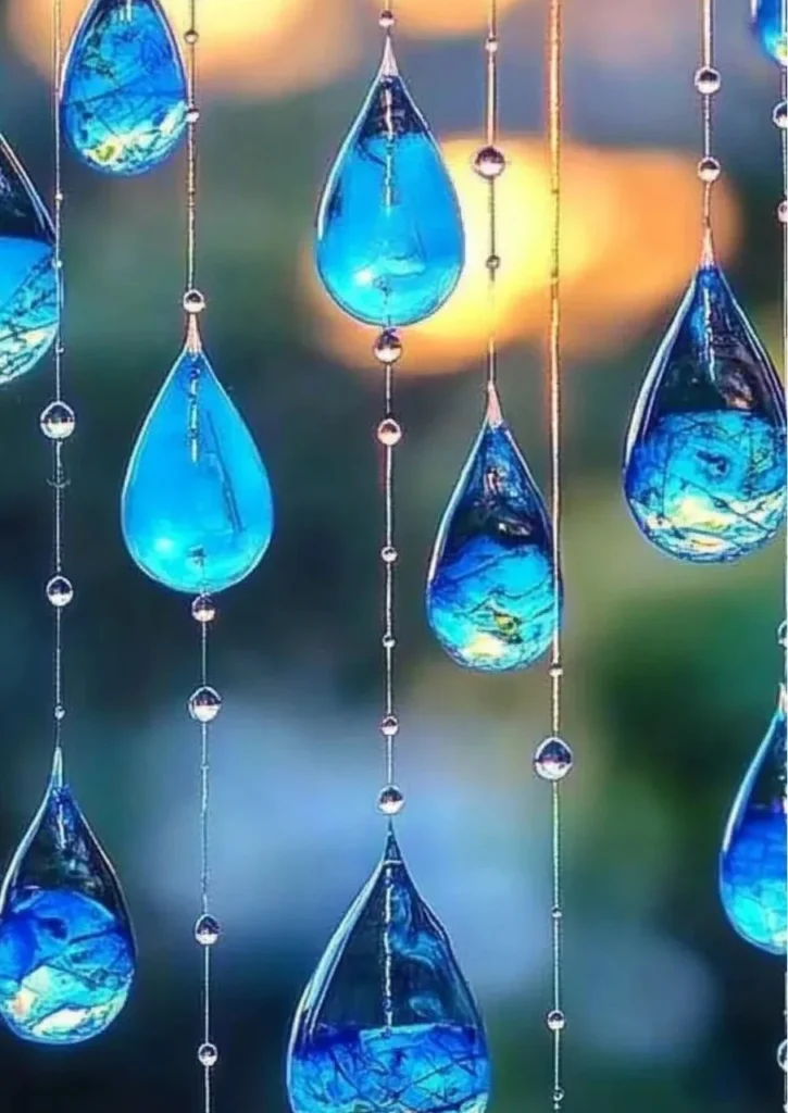 Blue crayon suncatchers created from melted crayons in colorful patterns