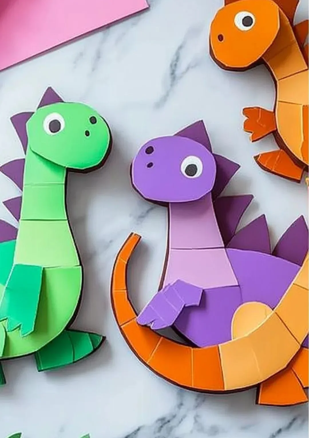 Colorful Dinosaur Suncatchers catching sunlight in a bright room