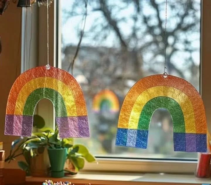 DIY rainbow spectrum suncatcher hanging in sunlight casting colorful reflections