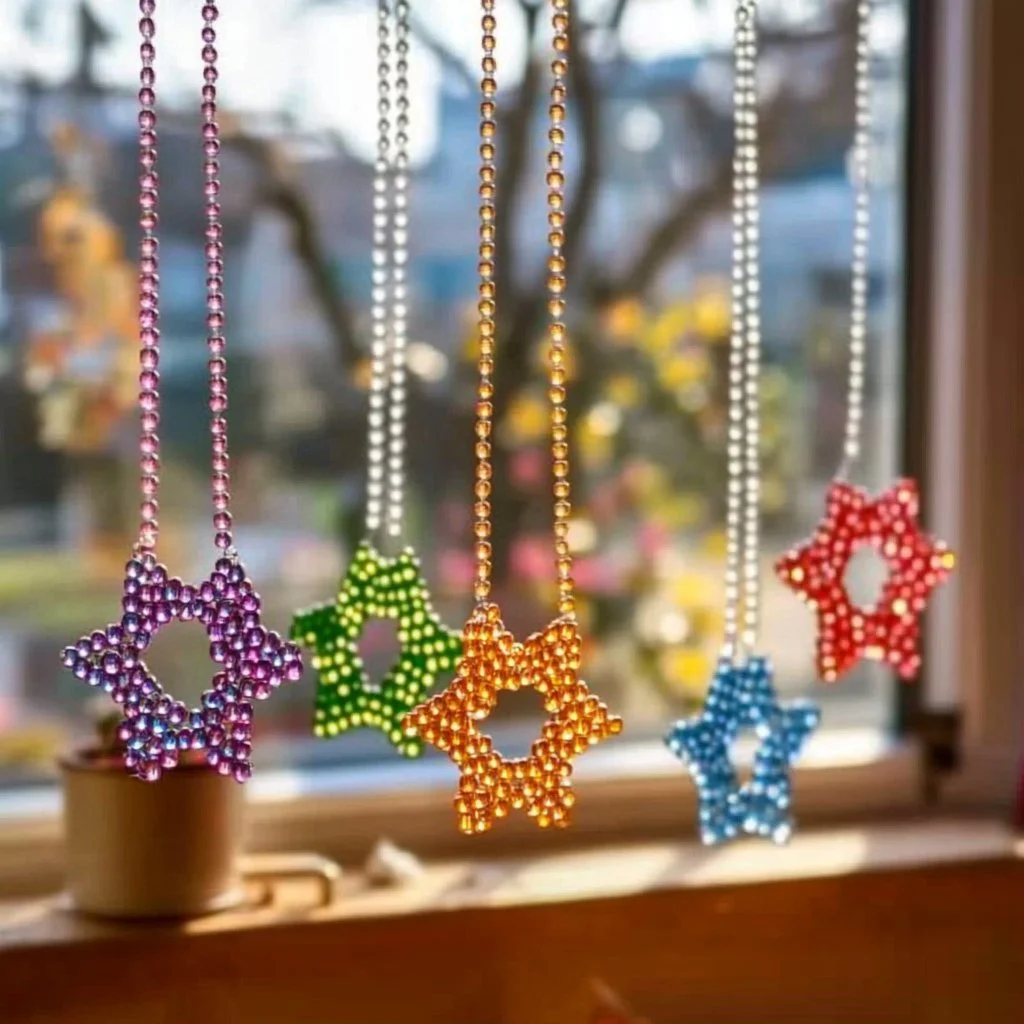 Colorful glow bead suncatchers catching sunlight and creating vibrant reflections.