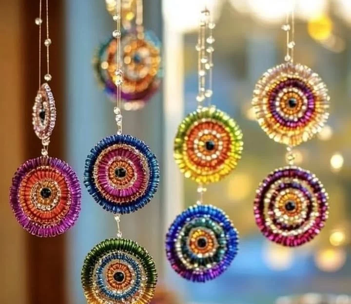 Colorful melted bead sun catchers hanging by a window