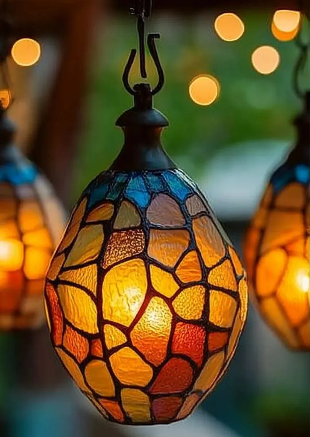 Colorful Pumpkin Suncatcher hanging in window, adding autumn charm.