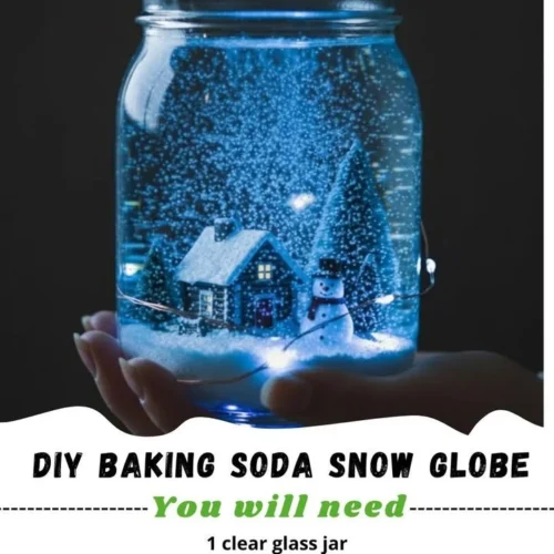DIY baking soda snow globe craft project with winter scene