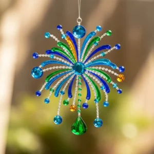 Colorful DIY Firework Suncatcher hanging in a window, casting bright reflections.
