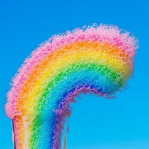 Colorful foaming rainbow rain showers creating a vibrant and refreshing atmosphere.