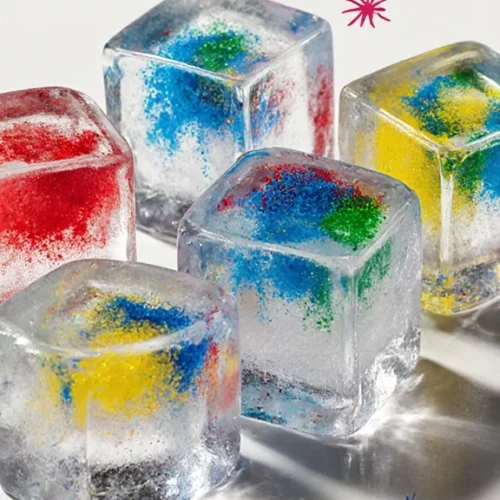 Frozen fireworks light up a winter night sky in vibrant colors.