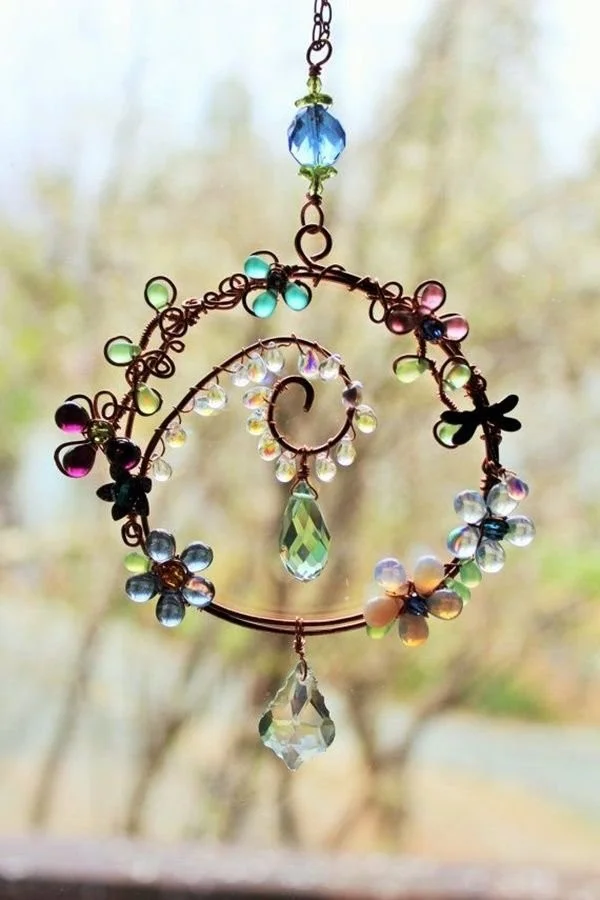 Colorful homemade sun catchers designed to enhance natural light in a room.