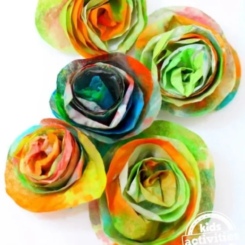 Colorful coffee filter flowers made by kids in a fun crafting activity