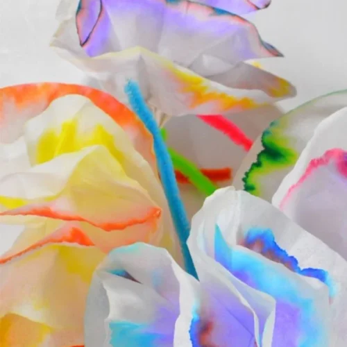 Kids art project using coffee filters to explore color science and creativity.
