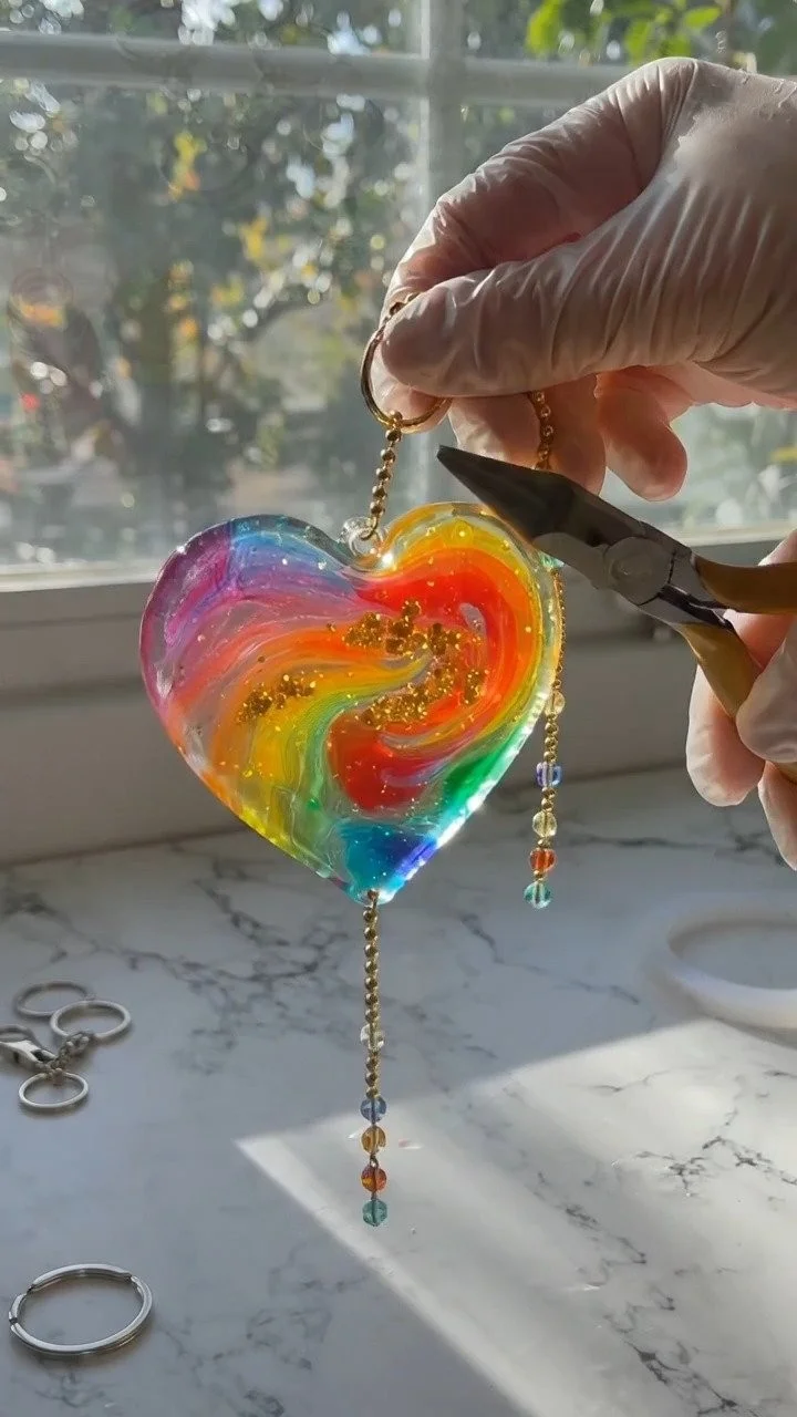 Colorful resin suncatcher charms glow beautifully in sunlight with vibrant translucent colors ✨ A magical decorative DIY. Save this project! #SuncatcherDIY #ResinCraft #KidsArt #CreativeKids #DIYDeco