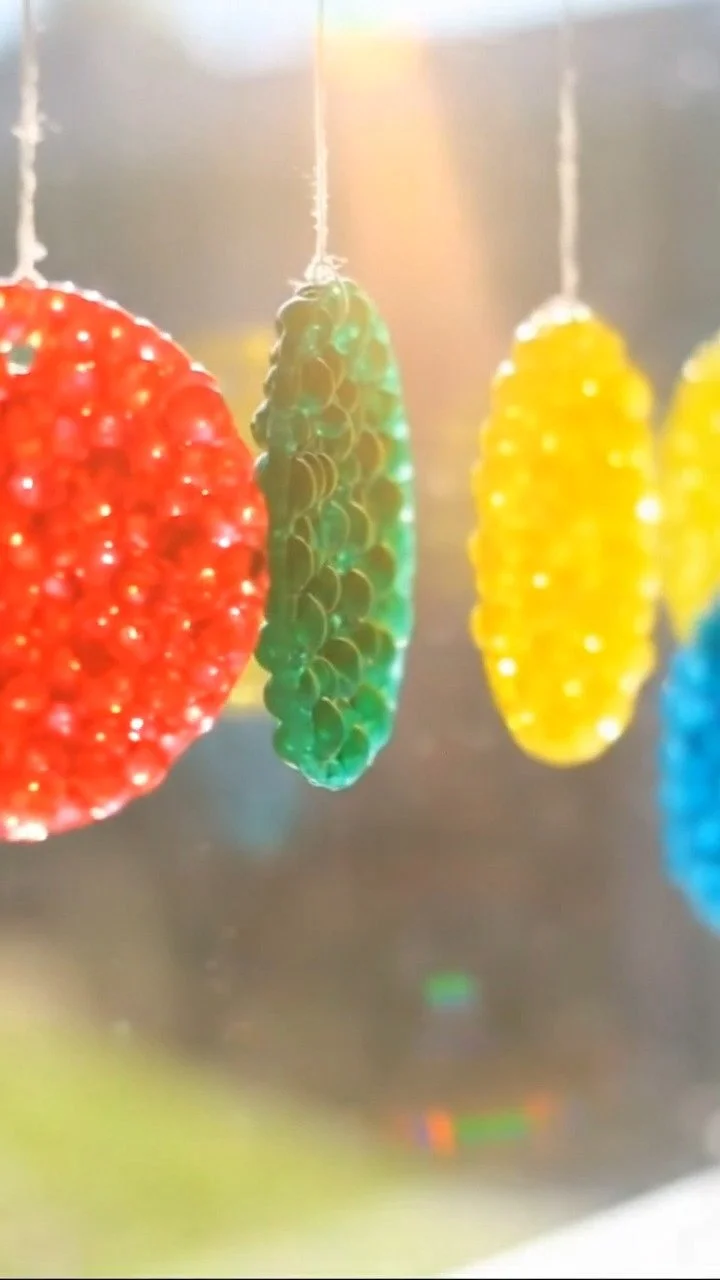 DIY colorful bioplastic suncatchers glow beautifully in sunlight ✨ A sustainable and creative DIY. Save this project!