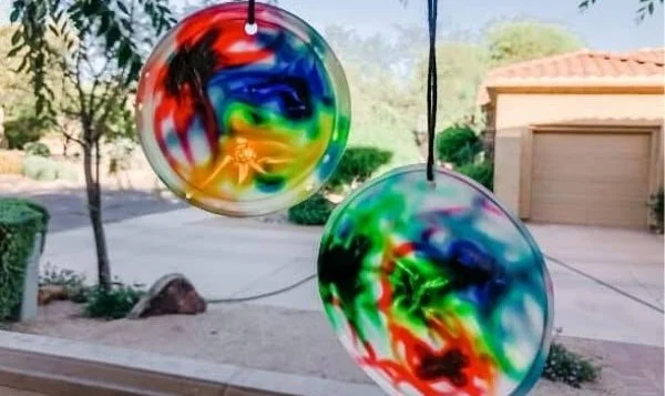 DIY glue sun catcher project showcasing colorful designs made from glue
