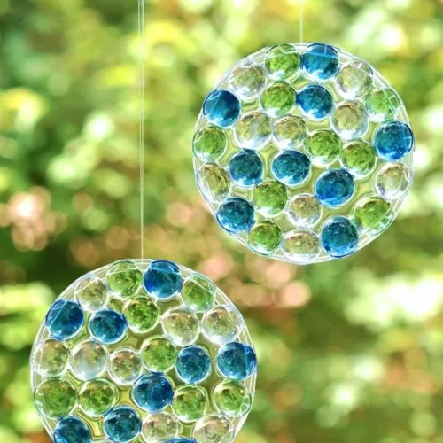 DIY sun catchers made with colorful glass beads hanging in sunlight