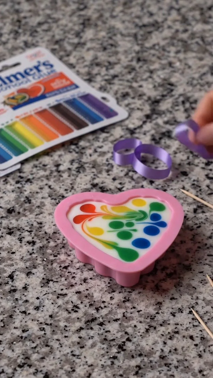 DIY swirled glue suncatchers create mesmerizing colorful patterns that shine beautifully in sunlight ✨ A fun and satisfying DIY. Save this project!