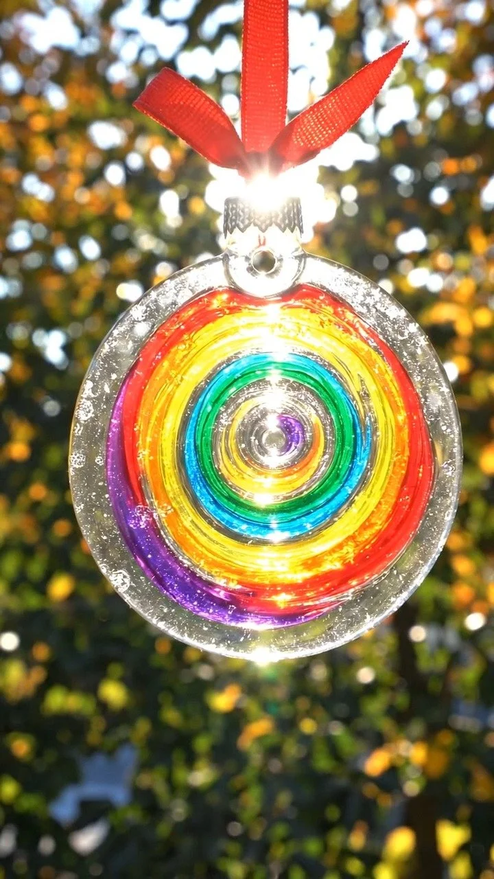 Swirl glue suncatcher ornament sparkles with colorful translucent swirls that catch the light beautifully ✨