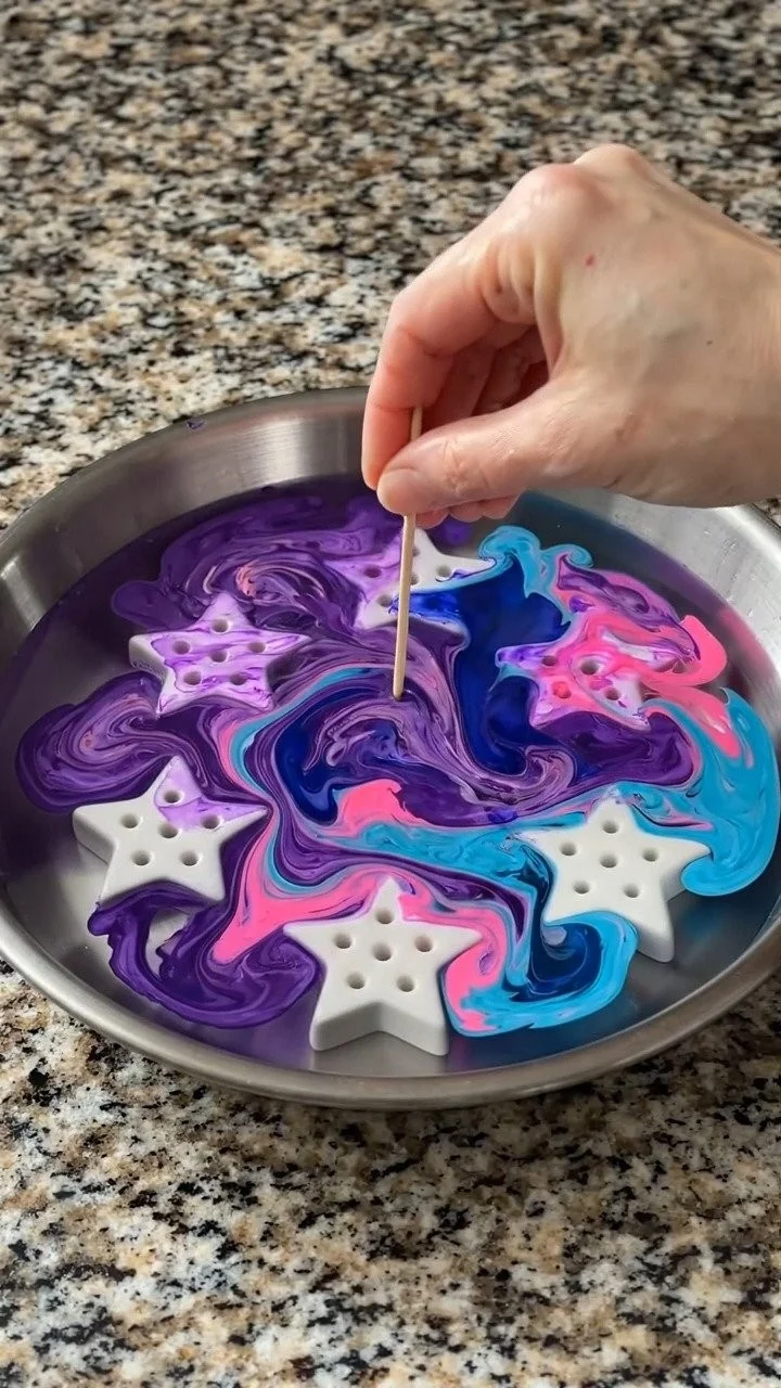 Water marbling stars swirl vibrant colors into beautiful star-shaped creations full of magical patterns ✨ A creative DIY kids love. Save this project!